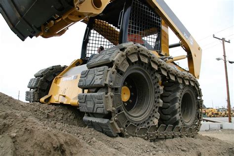 rubber tire vs track skid steer|tracked or wheeled skid steer.